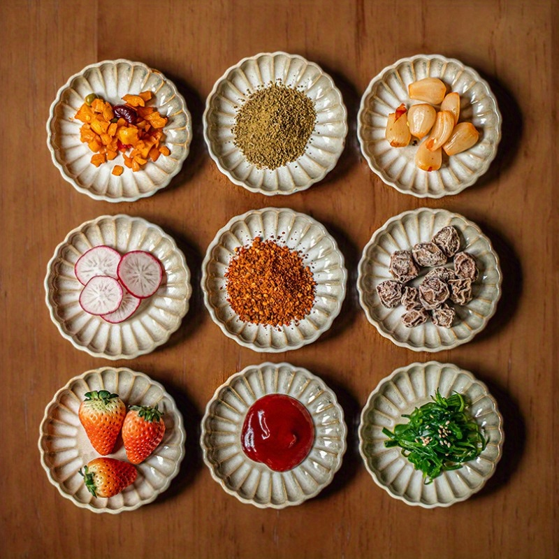 Two square yellow retro-style petal-shaped condiment dishes