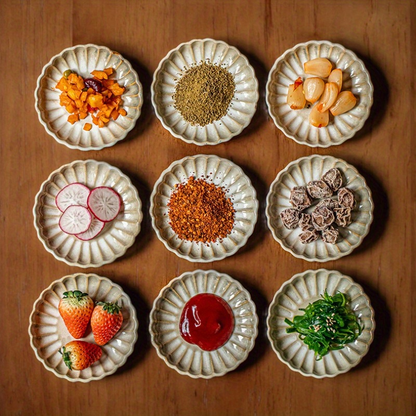 Two square yellow retro-style petal-shaped condiment dishes