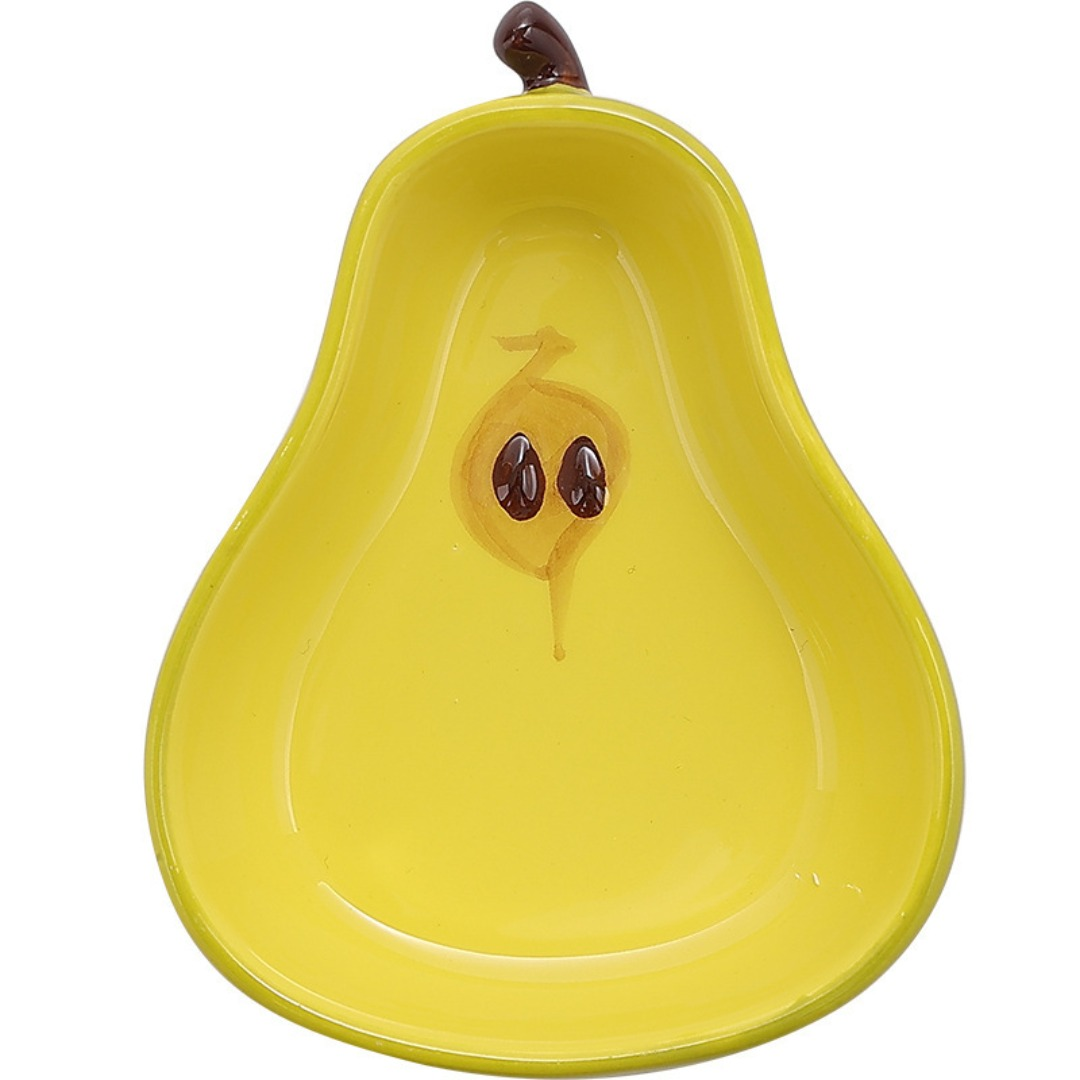 A ceramic fruit-shaped dipping dish - with a bright yellow and red design.