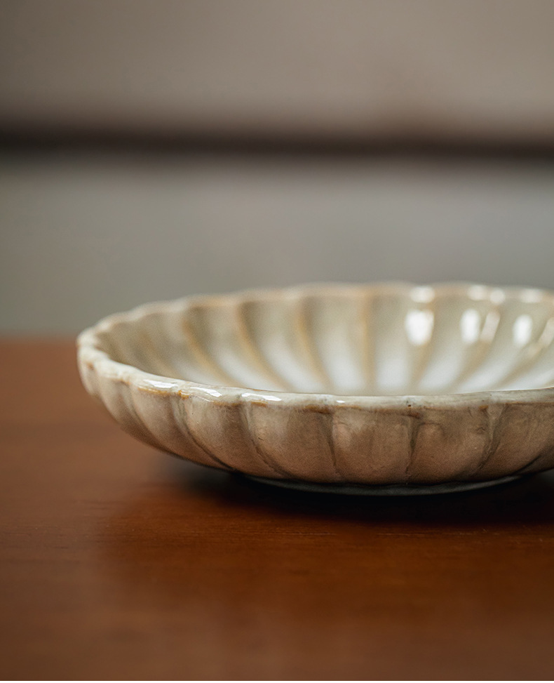 Two square yellow retro-style petal-shaped condiment dishes