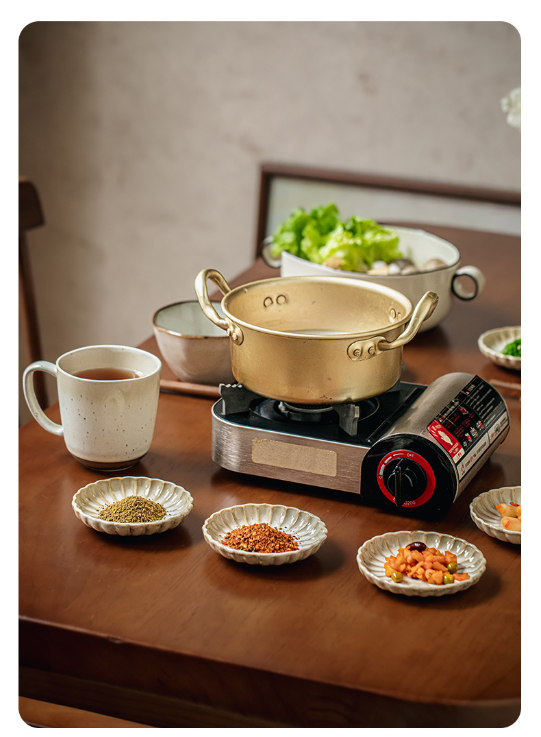 Two square yellow retro-style petal-shaped condiment dishes
