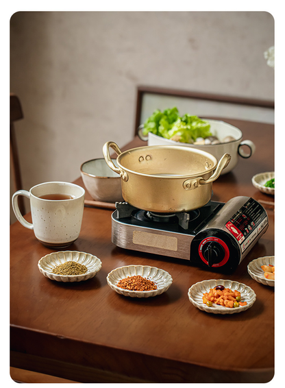Two square yellow retro-style petal-shaped condiment dishes