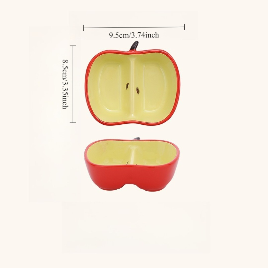A ceramic fruit-shaped dipping dish - with a bright yellow and red design.